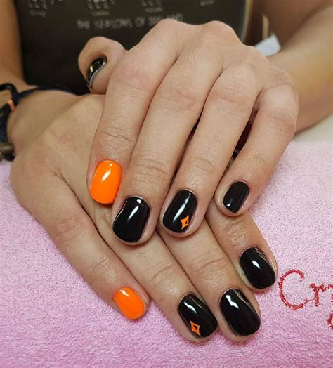 black nails orange tips|orange and black nail polish.